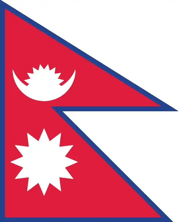 National flag of Nepal - Nepal’s flag is the world’s only non‑rectangular national flag: two stacked triangular pennants with crimson red bodies and blue borders, bearing a stylized white moon with eight rays and a twelve‑ray sun. Its unique shape conveys cultural identity and cosmic symbolism.