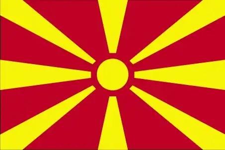 North Macedonia Flag - North Macedonia’s flag displays a stylized yellow sun with eight broadening rays that extend to the edges of a crimson-red field—a modern representation of the 