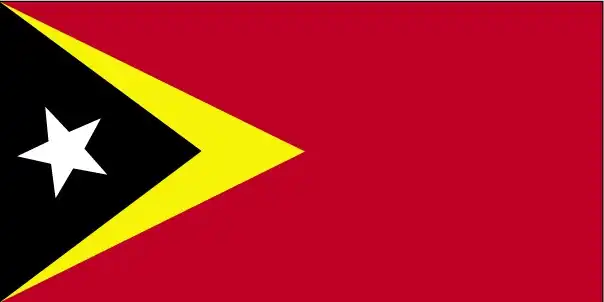 National flag of Timor-Leste - Timor‑Leste’s flag features a red field with overlapping yellow and black isosceles triangles at the hoist, centered by a white five‑pointed star—symbolizing the nation rising from colonial oppression.